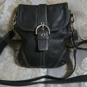 Coach Soho buckle flap crossbody in black fine grain leather silver hardware